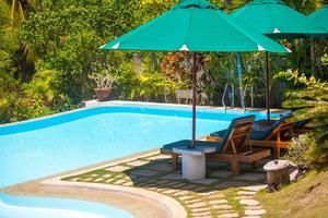 Nice view of the garden and swimming pool in a cozy little hotel photo