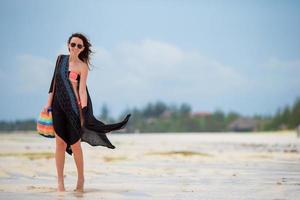 Young beautiful woman on beach vacation photo