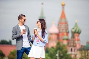 Young dating couple in love walking in city background St Basils Church photo