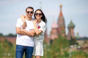 Young dating couple in love walking in city background St Basils Church photo
