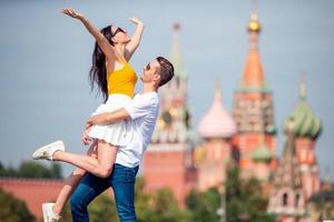 Young dating couple in love walking in city background St Basils Church photo