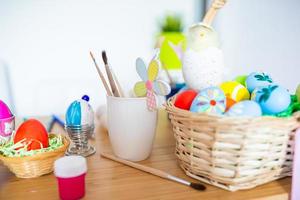Happy easter. eggs, paints, brushes for painting eggs photo