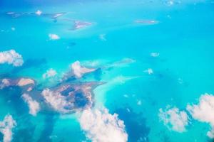 Beautiful perfect view of exotic islands and turquoise water from airplane photo