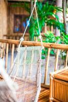 Hammock on terrace of cozy room in hotel in summer day photo