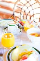 Healthy breakfast with fresh juice and sweet croissant in restaraunt resort outdoor photo