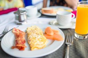 Healthy tasty breakfast on table in outdoor cafe photo