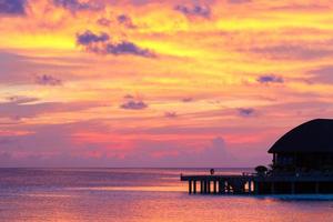 Beautiful colorful sky on sunset at tropical island in Indian Ocean photo