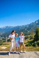 Beautiful happy family in mountains in the background of fog. Beautful landscape photo