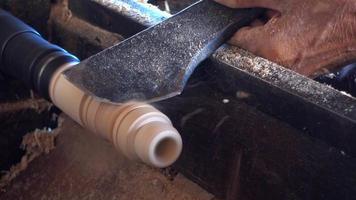Skilled artisan working of wooden piece video