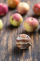 Apple with mold and fresh apple on background - mold growth and food spoilage concept photo