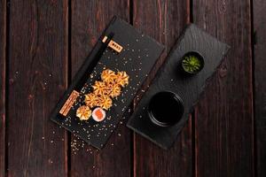 Japanese hot maki roll sushi with salmon top view - asian food concept photo