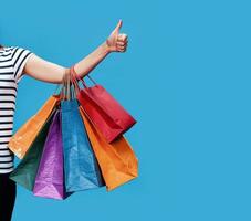 Happy young woman with shopping bags photo