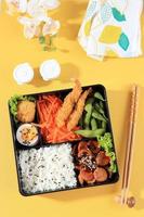 Japanese Bento Lunchbox with Steamed Vegetable, Egg, Nugget photo