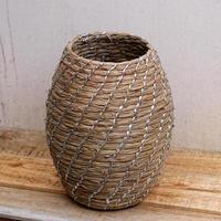 antique ethnic woven basket on wooden table photo