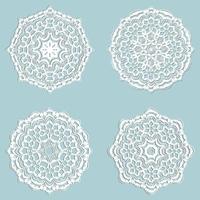 Set of four beautiful lace snowflakes made in vector. Decorative elements for cards, invitations, labels. White on light green background. vector