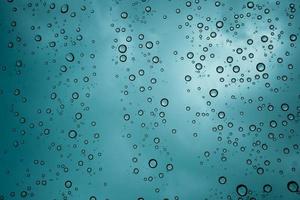 Drops of water on the windshield of the car in heavy rain. water drop backgrond. photo