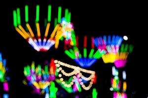 Blured Multi-colored neon lights at night. photo