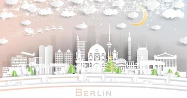 el horizonte de la ciudad de berlín, alemania, en estilo de corte de papel con copos de nieve, luna y guirnalda de neón. vector