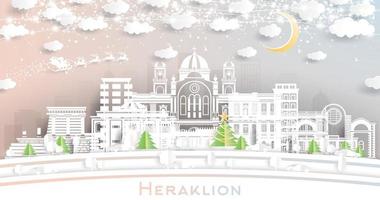 heraklion grecia. horizonte de la ciudad de invierno en estilo de corte de papel con copos de nieve, luna y guirnalda de neón. vector