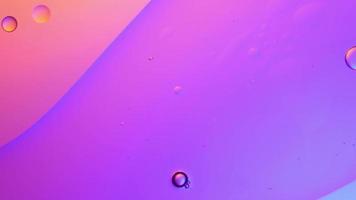 pastel color of oil drop floating on the water. The art of water surface for your products display and artwork design with copy space. holiday light background. holiday postcard background. video