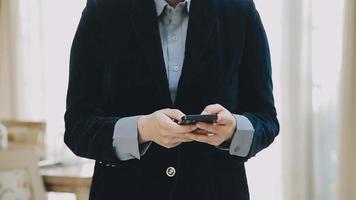 Image of two young businessmen using touchpad at meeting video