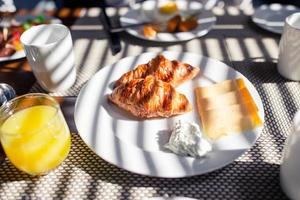 Fresh and delisious breakfast in outdoor cafe photo