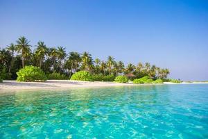 Idyllic perfect turquoise water at exotic island photo