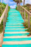 Wooden Walkway to the sandy beach photo