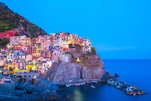 View on architecture of Manarola town in sunset light. Manarola is one of the most popular town in Cinque Terre National park, Italy photo