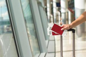 Closeup passports and boarding pass at airport indoor photo