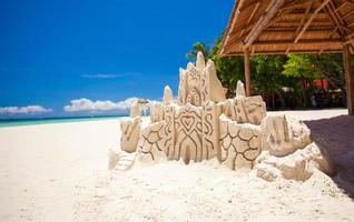 Sand castle on a white tropical beach in Boracay photo