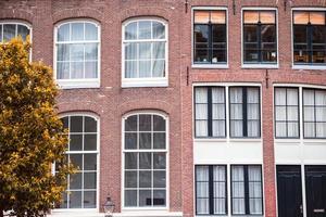 Traditional dutch medieval houses in Amsterdam capital of Netherlands photo