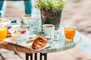 Fresh and delisious breakfast in outdoor cafe at european city photo