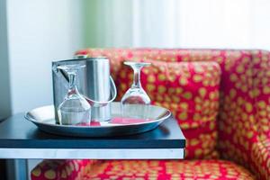 Romantic bedroom with wine glasses in luxury hotel interior photo