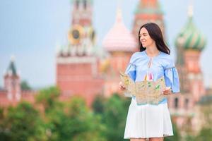 Happy young urban woman in european city. photo