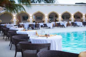 Summer empty open air luxury restaraunt at exotic hotel photo