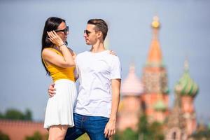 Young dating couple in love walking in city background St Basils Church photo