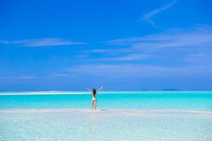 Young woman enjoy tropical beach vacation photo