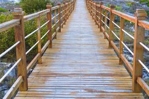 Wooded bridge and turquoise sea in Cayo Largo, Cuba photo