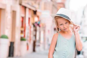 Adorable fashion little girl outdoors in European city Rome photo