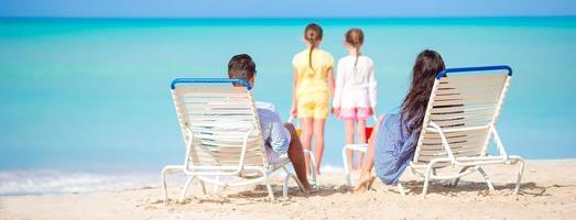 Young family on the beach photo