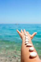 Handful of sea stones on the beach. Conceptual design photo