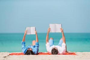 Young couple on white beach during summer vacation. photo