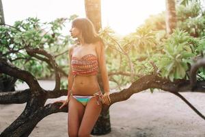 Happy girl in the jungle on caribbean island photo