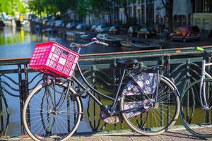 Colorful bikes on the bridge in Amsterdam, Netherlands photo