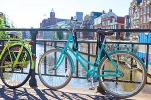 Colorful bikes on the bridge in Amsterdam, Netherlands photo