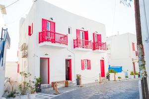 Typical house withe colorful windows and doors in the narrow streets of Mykonos, Greece. photo