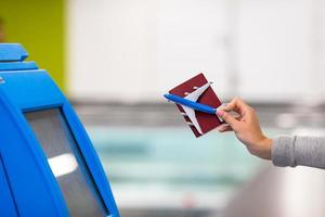 Terminal for self-check-in for flight or buying airplane tickets at airport photo