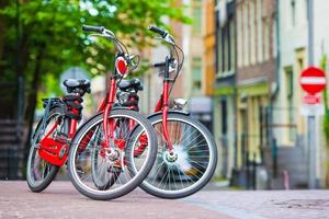 Red Bikes on the bridge in Amsterdam, Netherlands photo