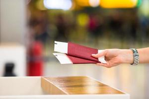 Closeup passports and boarding pass at airport indoor photo